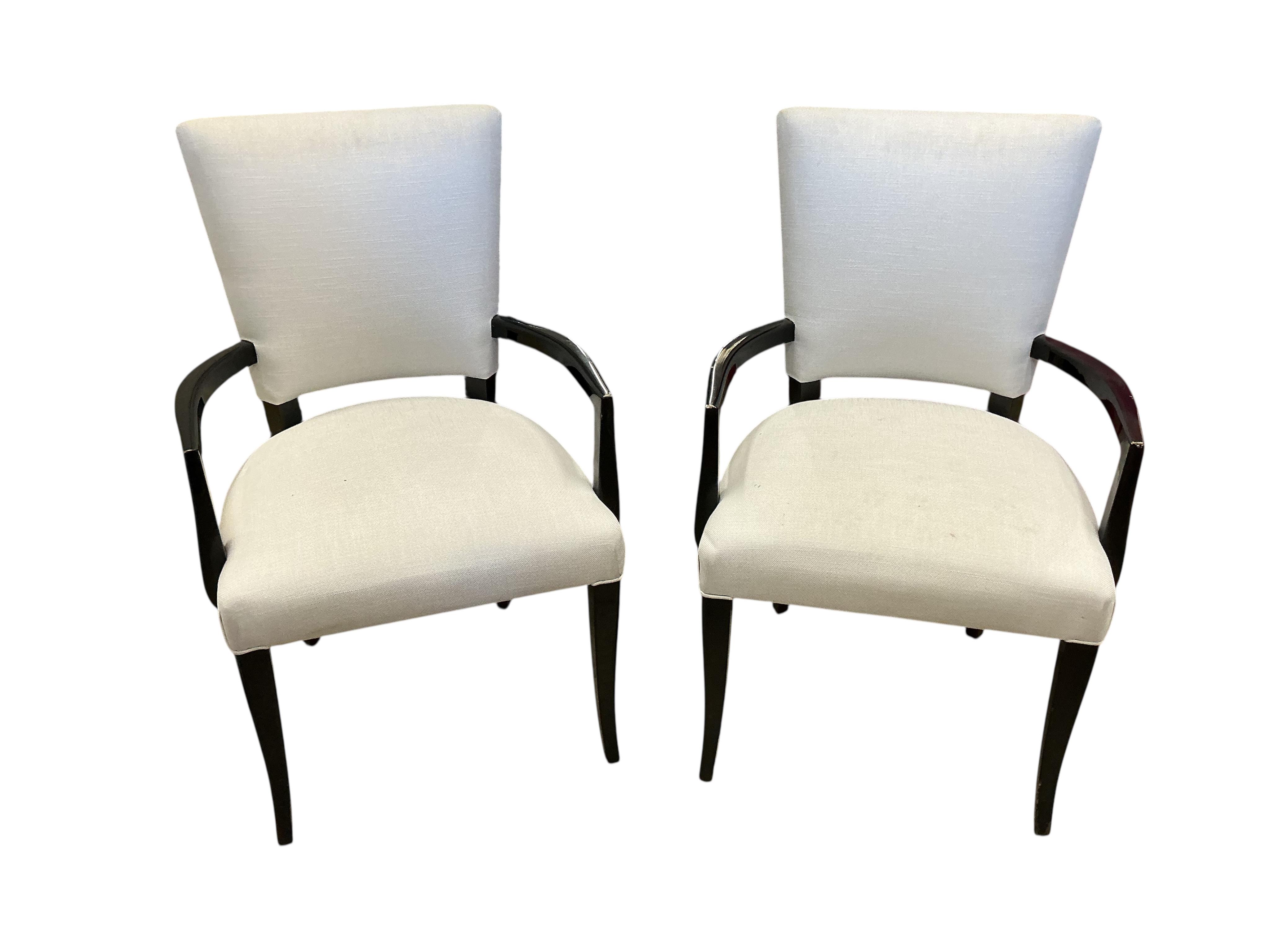 Seven contemporary ebonised and grey fabric elbow chairs, five with arms